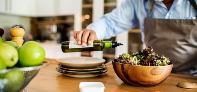 A man is making salad